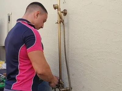Pink Plumbing plumber on the job in Sydney