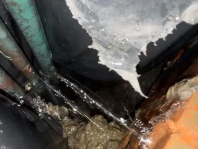 Water leaking inside a ceiling cavity - tracked and repaired by Pink Plumbing