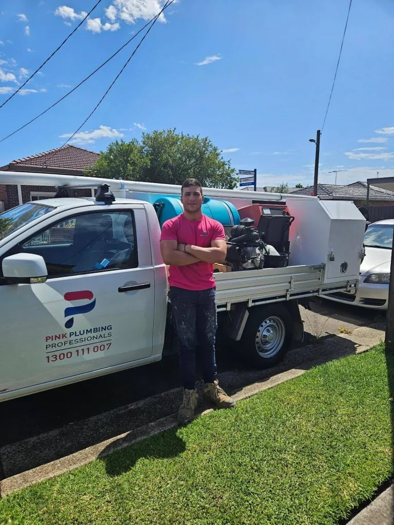 Pink Plumbing van on site jet blasting a stormwater drain