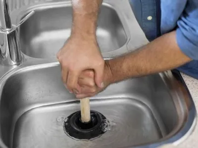 Pink Plumbing plumber at work